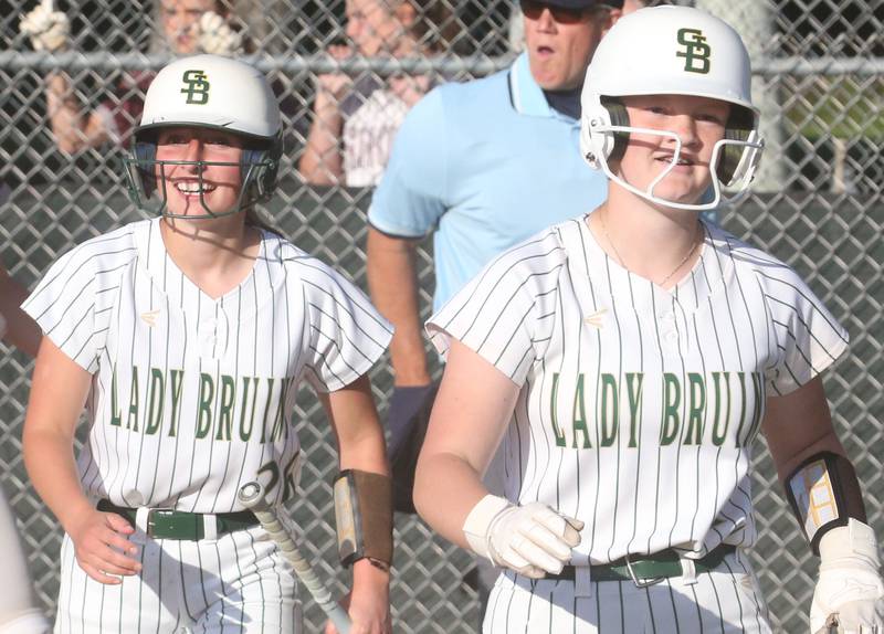 St. Bede's Emma Slingsby and Lili McClain react after scoring back-to-back runs against Illinois Valley Central during the Class 2A Regional final on Friday, May 23, 2025 at St. Bede Academy.