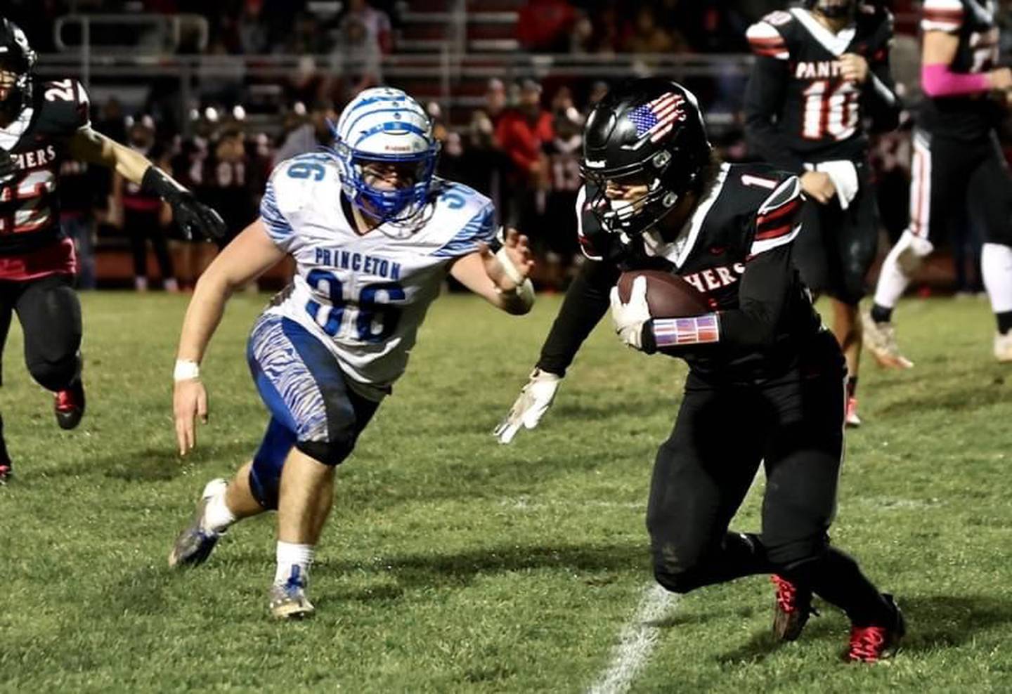 Princeton's Common Green zeroes in on Erie-Prophetstown's Demetree Larsen Friday night at Prophetstown. The Tigers won 61-14.