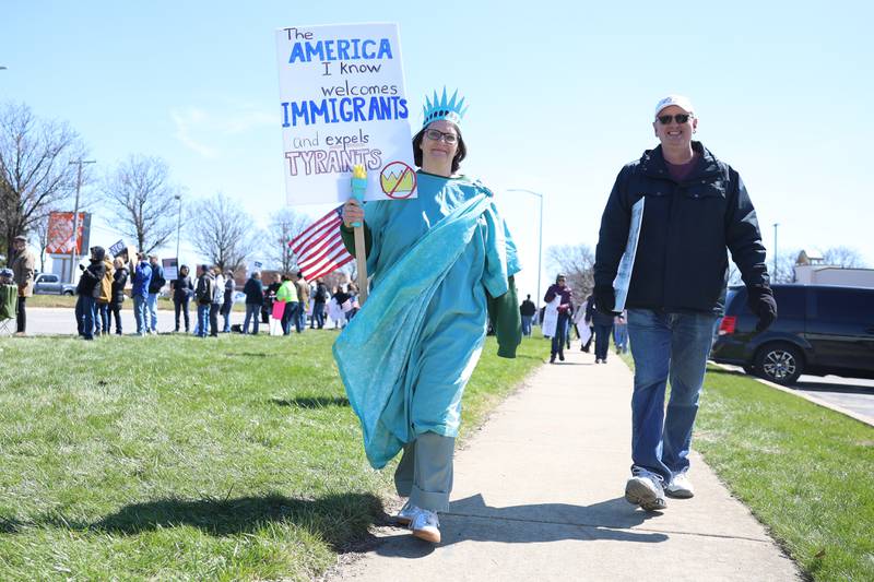 A protestor dresses as Lady Liberty at the No Kings rally on Saturday, March 28, 2026 in Joliet.