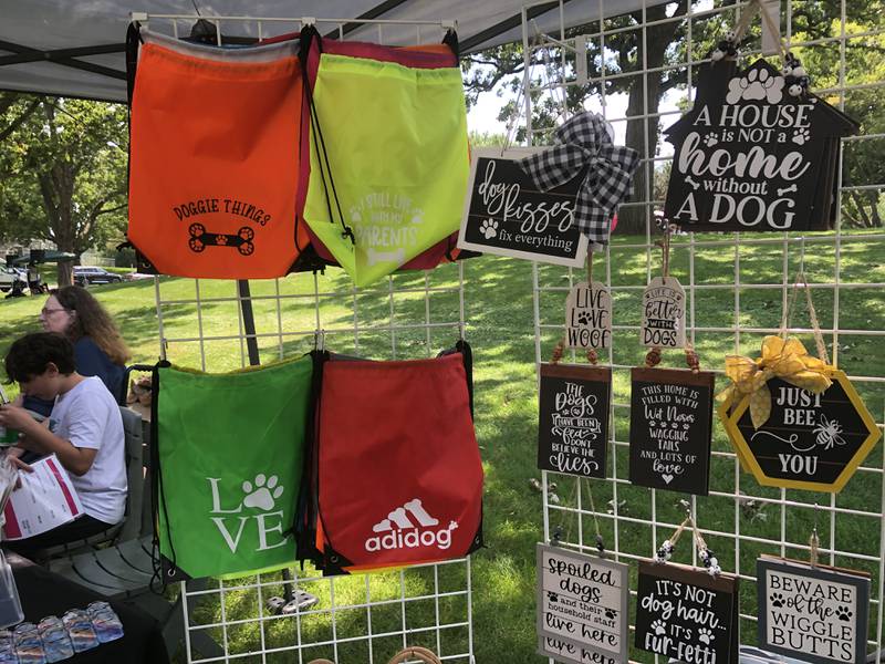 Dog-themed merchandise for sale at Pawfest in Huntley Aug. 3, 2024.