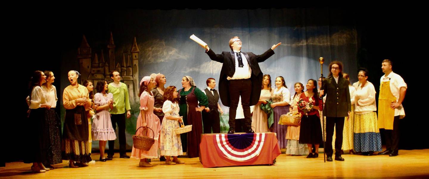 The Herald played by Wyatt Oneson proclaims to the villagers "The Prince is Giving a Ball" during a rehearsal of Engle Lane's "Cinderella."