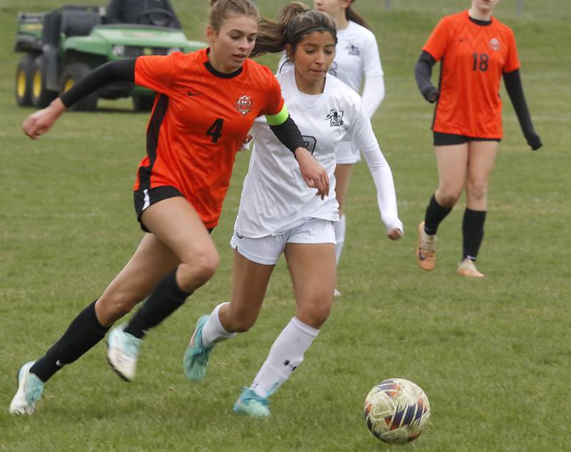 Crystal Lake Central's Hadley Ferrero and Kaneland's Alondra Mendoza chase down the ball during a nonconference soccer game on Thursday, April 10, 2025, at Crystal Lake Central High School.