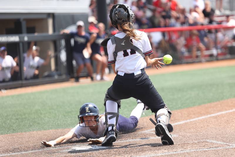 Lemont’s Addison McGrath slides home safely to end the game against Antioch 1-0 in the Class 3A state championship game on Saturday, June 10, 2023 in Peoria.