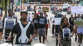 Dozens march in Joliet to protest Eric Lurry’s overdose death in police custody