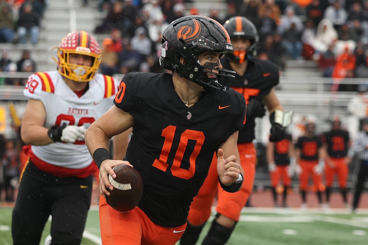 Lincoln-Way West’s Chase Hetfleisch rolls out of the pocket against Batavia on Saturday, Nov. 9, 2024 in New Lenox.