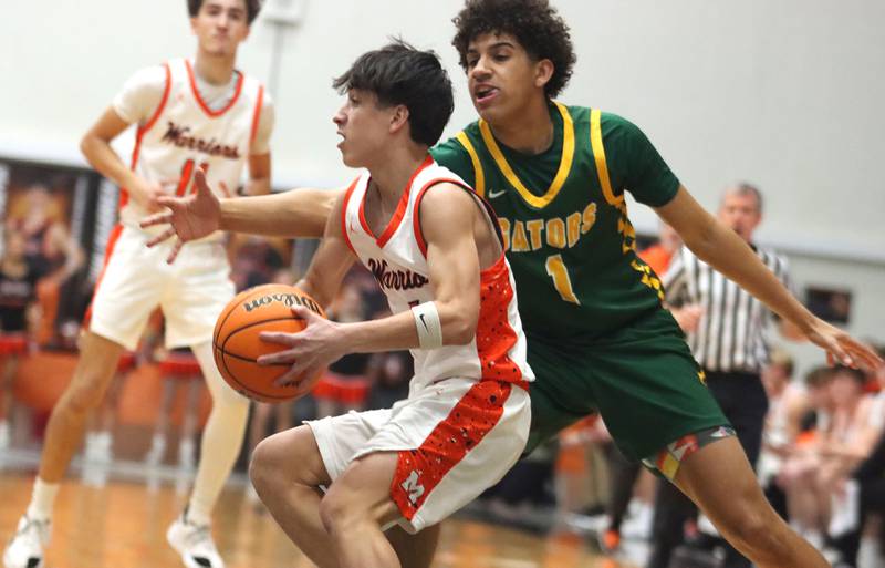 McHenry’s Cole Tapia, front, tries to get past Crystal Lake South’s Noah Cook  in varsity boys basketball on Friday, Feb. 20, 2026, at McHenry High School in McHenry.