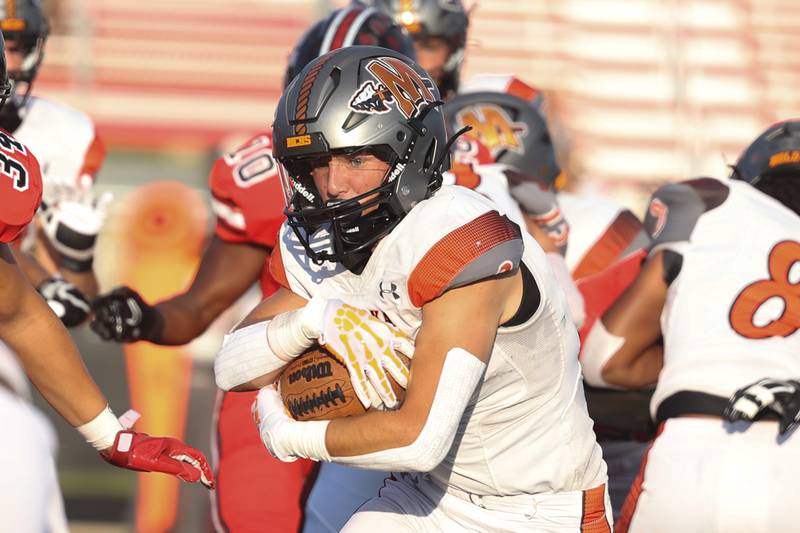 Minooka’s Joseph Partridge rushes against Bolingbrook. Friday, Aug. 26, 2022, in Bolingbrook.
