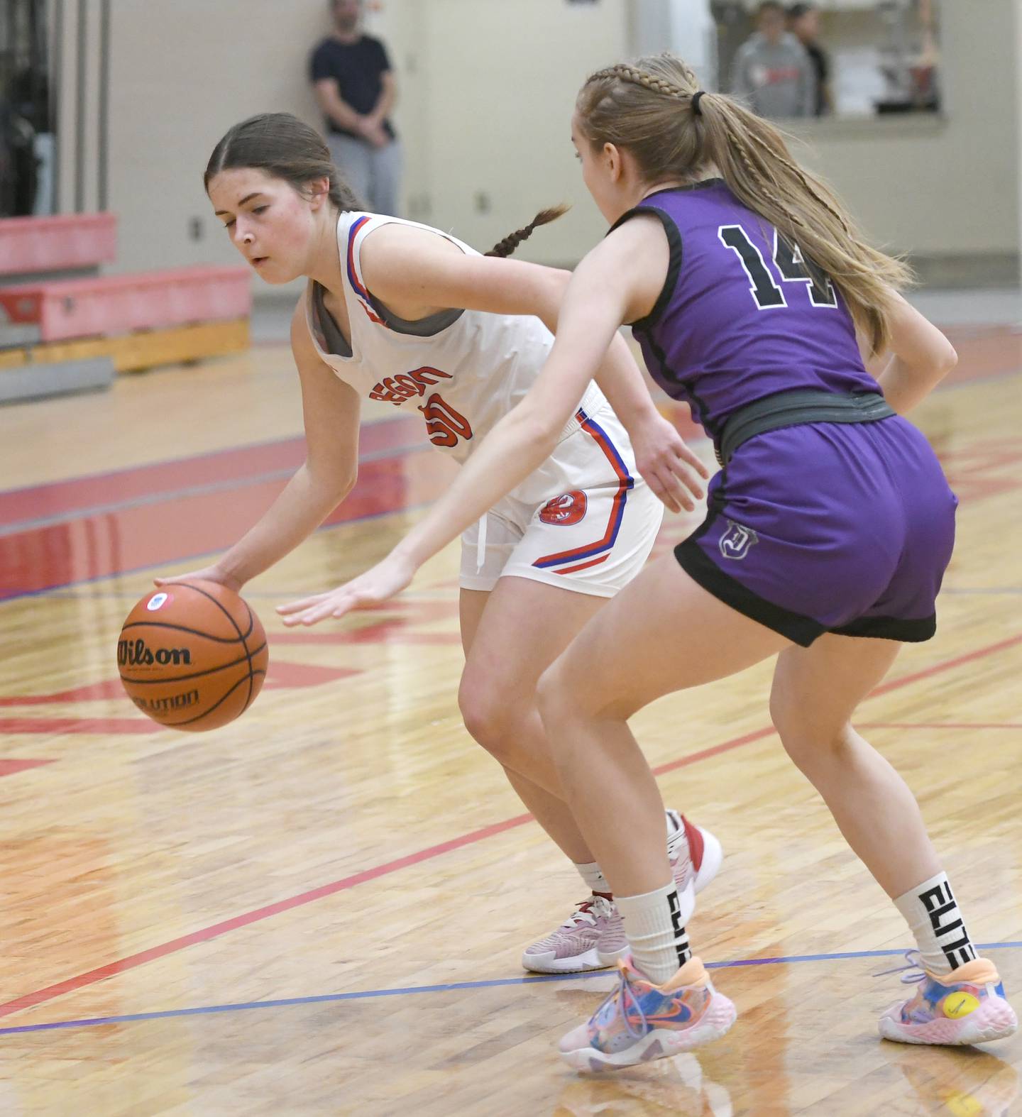 Oregon's Mya Engelkes (30) dribbles as Dixon's Abby Knipple guards during Big Northern Conference action at the Blackhawk Center in Oregon on Saturday, Jan, 21.