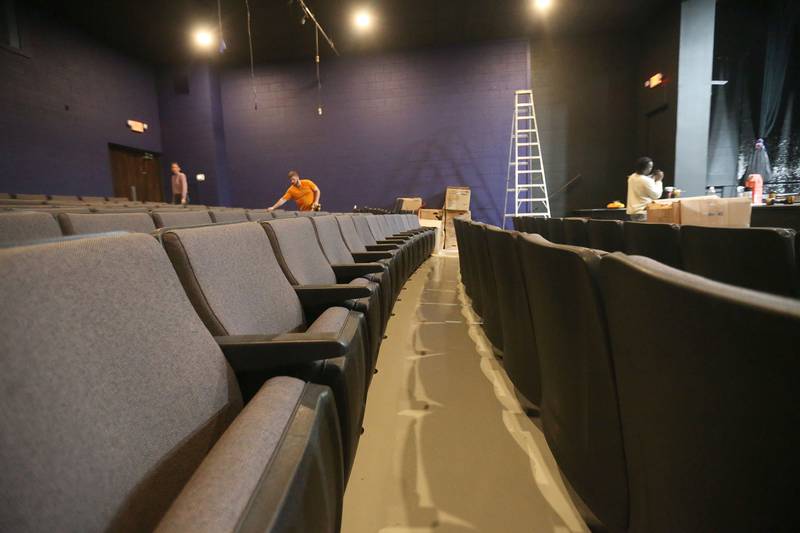 New seats are installed on Monday at Stage 212 in La Salle. Other renovation work at the theater includes a new stage curtain, acoustic panels for the walls, ceiling repairs, HVAC improvements, sound enhancements and lighting upgrades and painting.