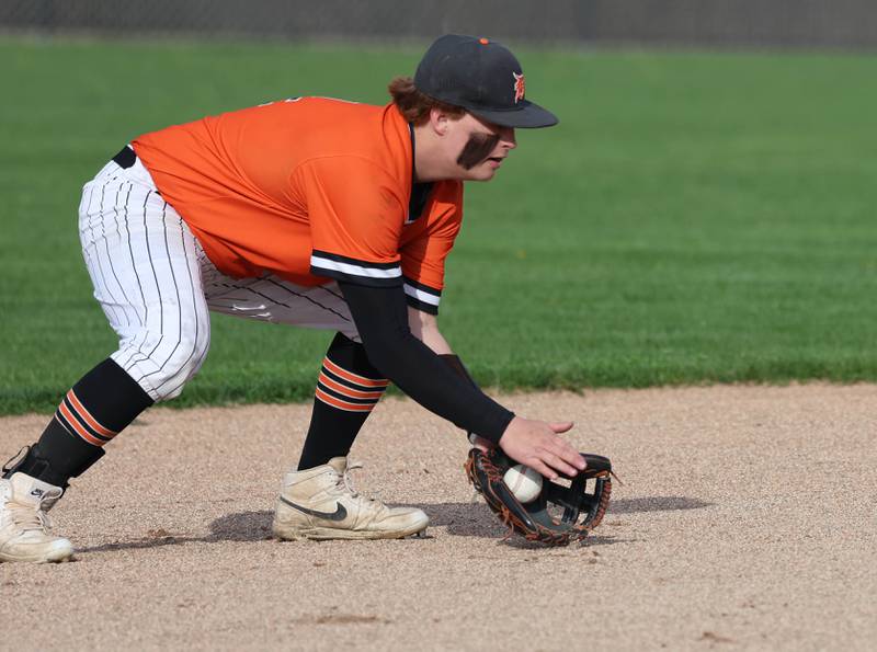DeKalb's Breydon Martin fields a grounder at shortstop Monday, April 20, 2026, during their game against Waubonsie Valley at DeKalb High School.