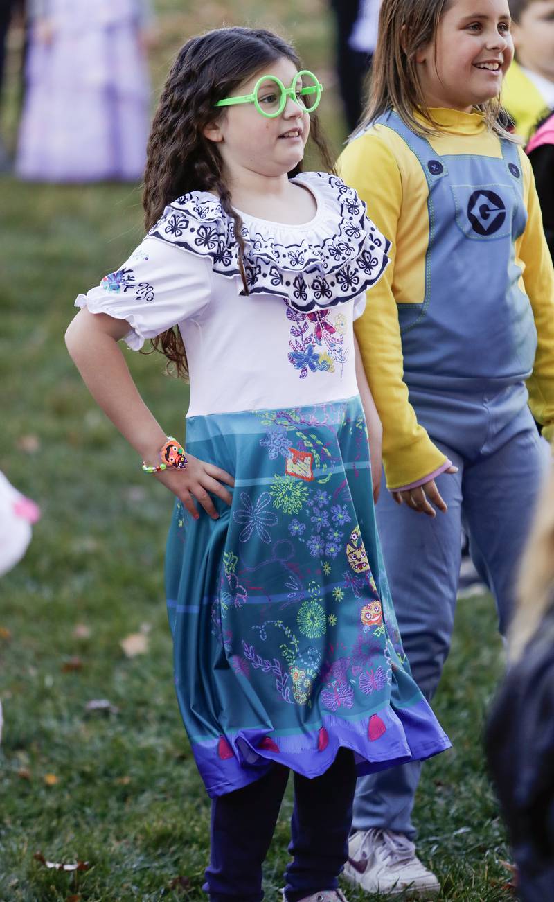 Kiara Evola, 8, of Downers Grove dances during the Monster Mash Dance Party at Fishel Park in Downers Grove, Ill. on Saturday, October 29, 2022.