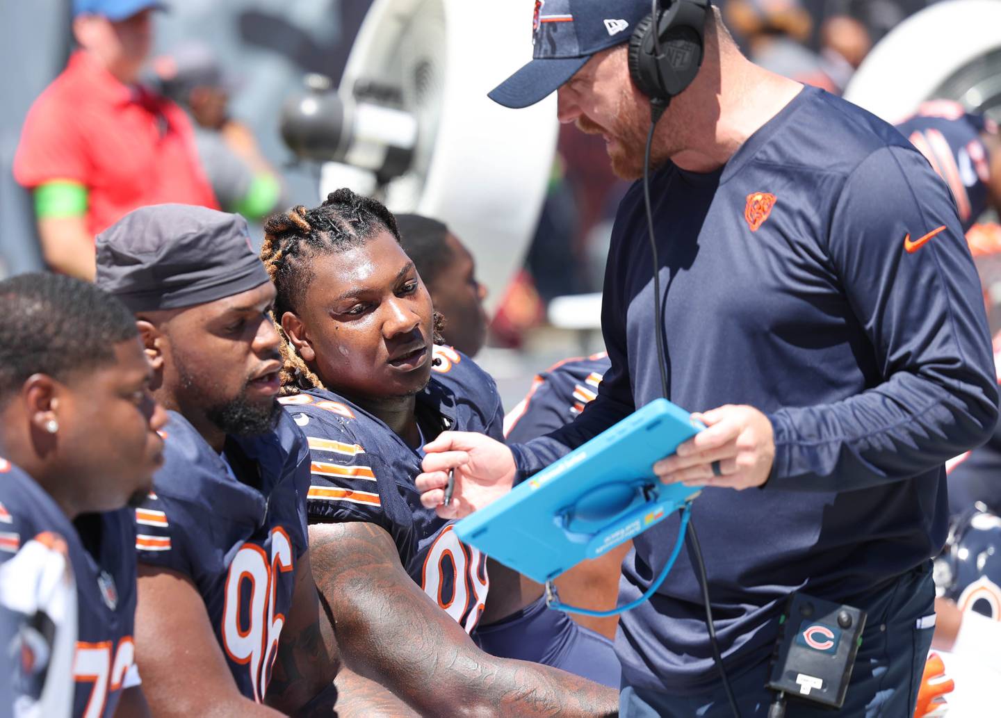 Chicago Bears defensive tackle Zacch Pickens (left) and defensive tackle Gervon Dexter Sr. listen to a coach during their preseason game against the Tennessee Titans Saturday, Aug. 12, 2023, at Soldier Field in Chicago.