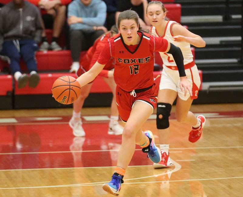 Yorkville's Lainey Gussman sprints down the floor to move the ball over to the Ottawa side of the court on Monday, Dec. 4, 2023 at Kingman Gym.