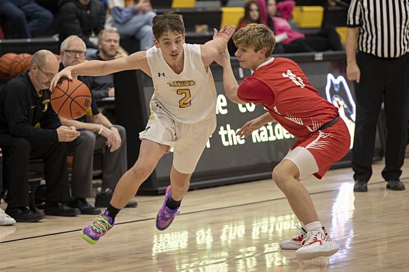 AFC’s Noah Danielson drives past Oregon’s Avery Lewis Wednesday, Nov. 29, 2023 in Ashton.