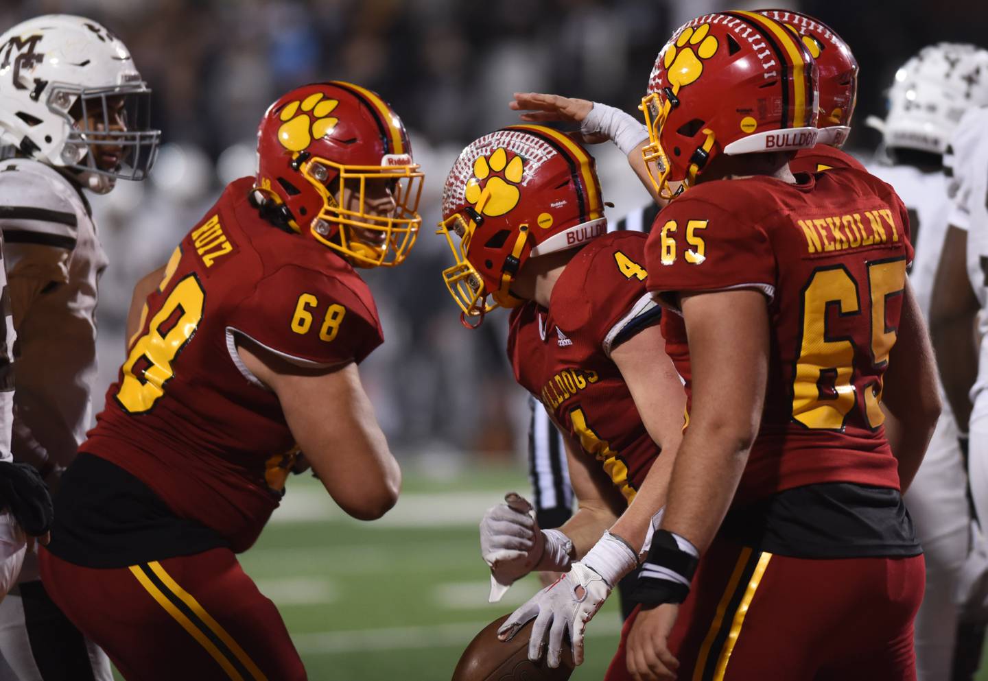 Joe Lewnard/jlewnard@dailyherald.com
Batavia's Charlie Whelpley (4) celebrates a touchdown with teammates including Nick Ruiz, left, and Jackson Nekolny during the Class 7A football state title game against Mount Carmel at Memorial Stadium in Champaign on Saturday, Nov. 26, 2022.