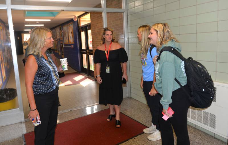 Oregon Junior/Senior High School Principal Heidi Deininger and State Representative Tony McCombie (R-Savanna) visit with students in one of the hallways at the high school during McCombie's 'Principal for  Day' visit on Wednesday, Sept. 20, 2023.