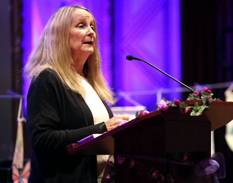 Jana Roe, a domestic violence survivor and activist, speaks during the Safe Passage Candlelight Vigil and Survivor Speak Out Monday, Oct. 6, 2025, at the Egyptian Theatre in DeKalb.