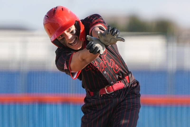 Benet’s Brandon Sconza (2) does a Dragon Ball Z celebration after hitting a double against Oswego during a baseball game at Oswego High School on Tuesday, March 25, 2025.