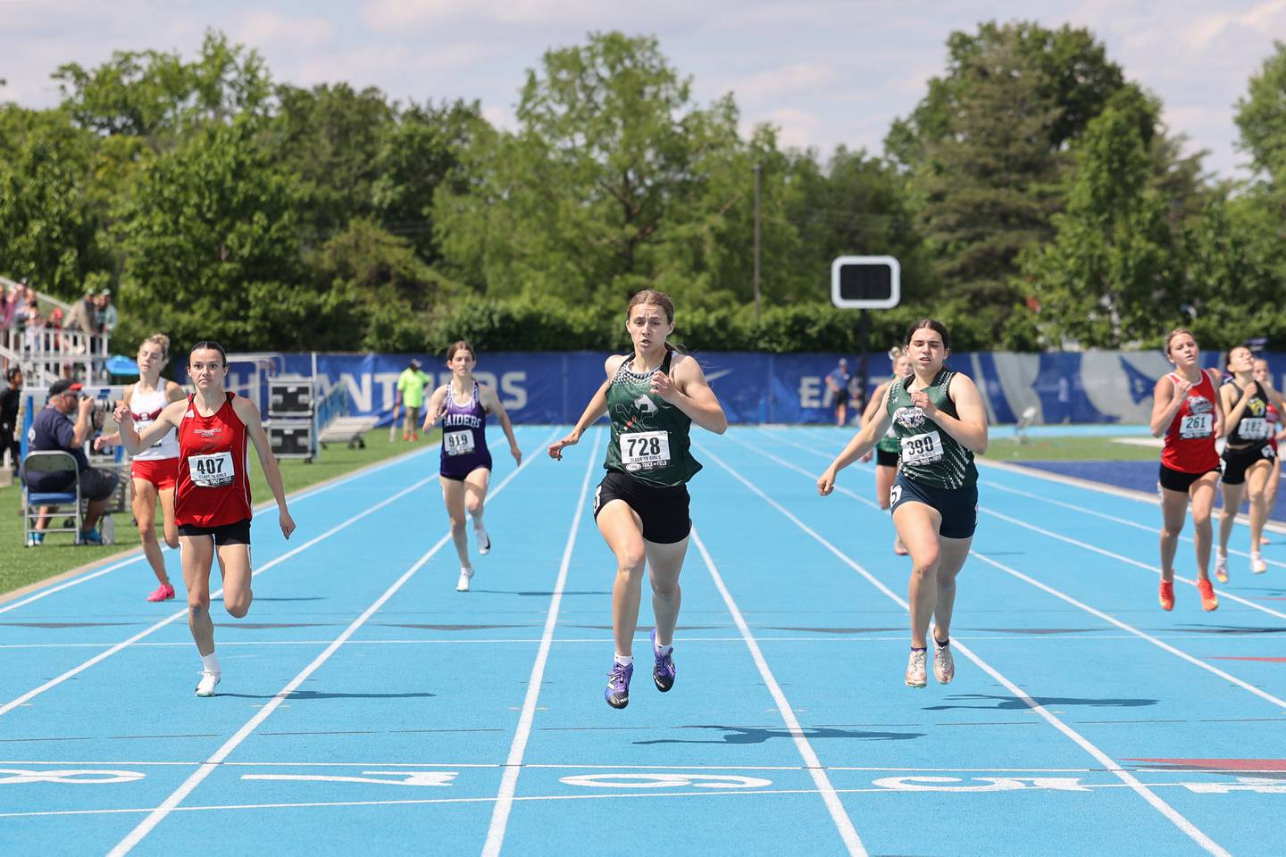 West Carroll’s Emma Randecker, center, finishes in first place the 400 m dash during the IHSA Class 1A Girls Track & Field State Finals on Saturday, May 24, 2025. Henry-Senachwine’s Daniella Bumber, left, would claim third place in the race.