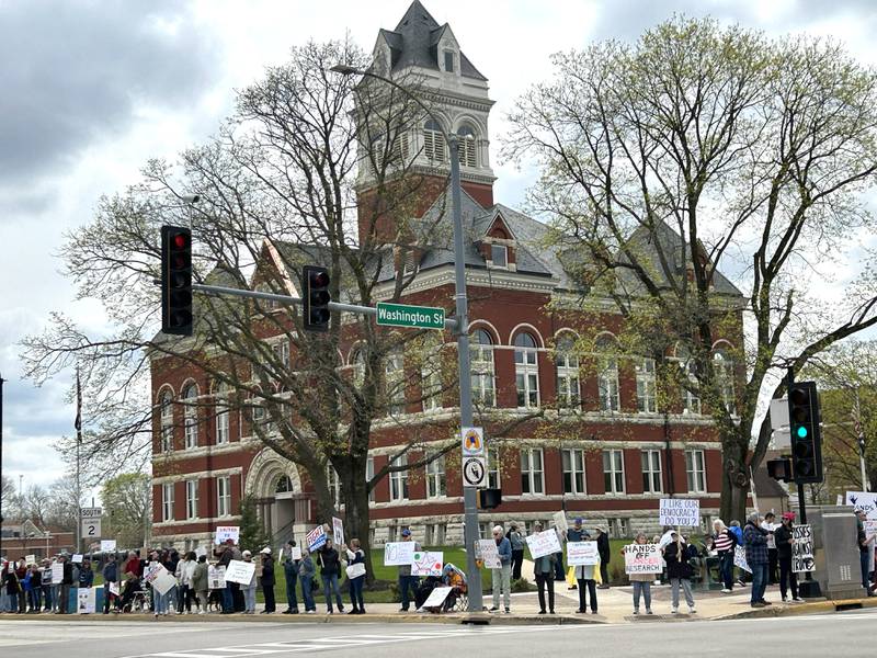Approximately 250 people attended a Hands Off rally on Saturday, April 19, 2025 around the historic Ogle County Courthouse in Oregon. Participants carried signs critical of  the Trump administration. Saturday's rally followed an April 5 rally held at the same location.