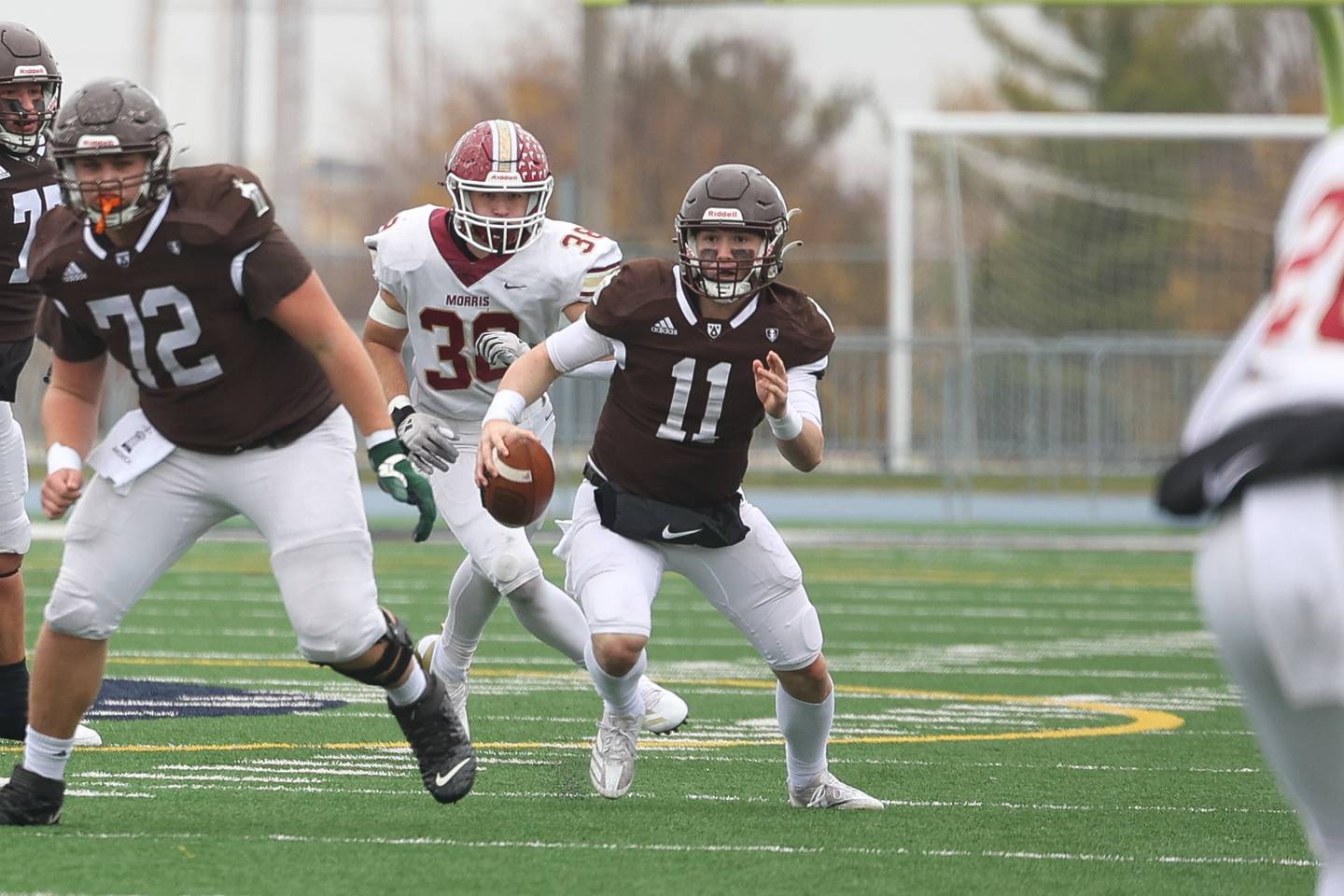 Joliet Catholic’s Lucas Simulick scrambles out of the pocket against Morris in the Class 5A semifinal on Saturday, Nov. 23, 2024.