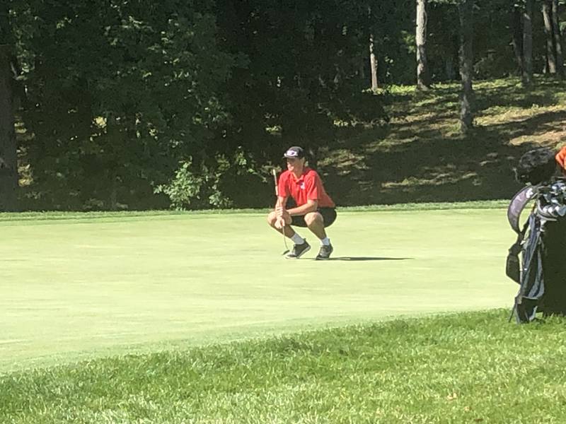 Hall's Grant Plym lines up at putt at TPC Deere Run Monday.