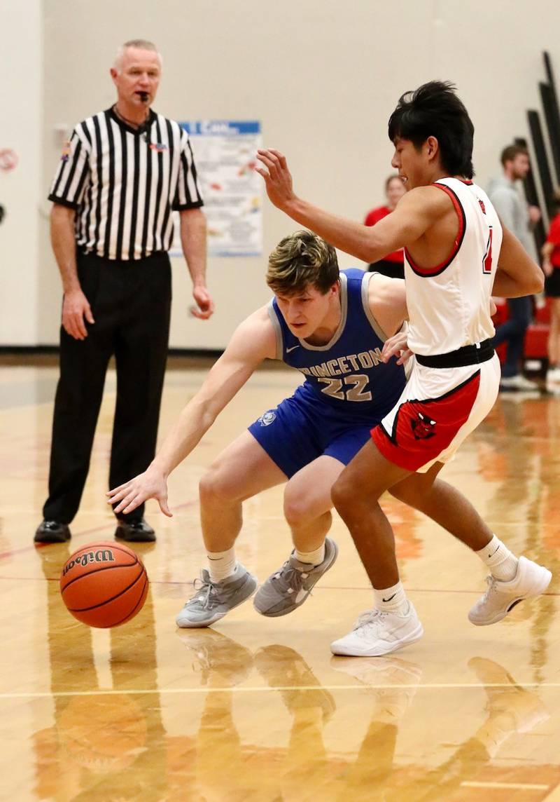 Princeton senior Evan Driscoll drives on Hall's Mark Cissell Friday night in Spring Valley. The Tigers won 63-47.