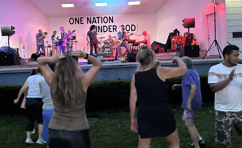 People dance to the music of the Chicago Tribute Anthology band on Friday, July 25, 2025 at the Mt. Morris Jamboree Concert Series.