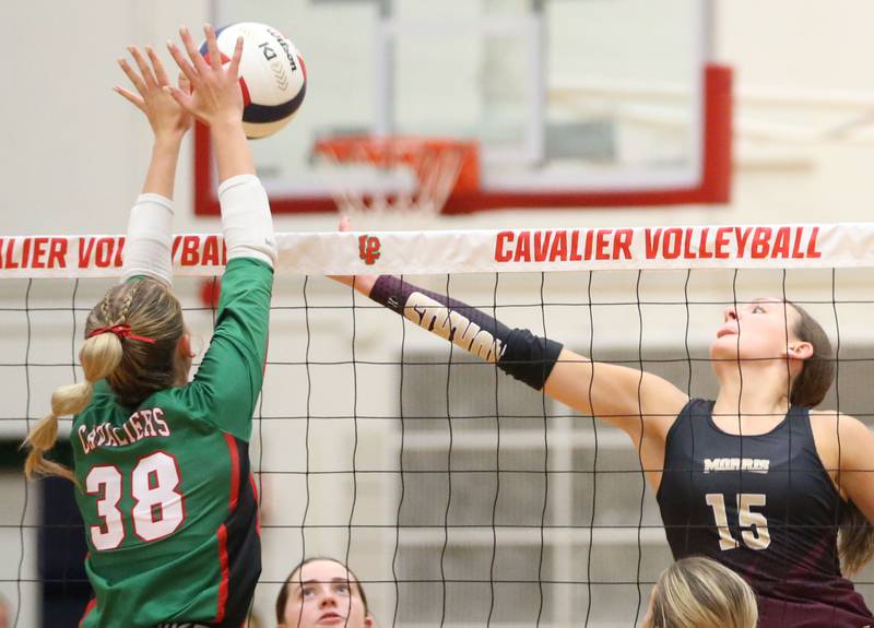 L-P's Aubrey Duttlinger pushes the ball past Morris's Lily Hansen on Thursday, Oct. 10, 2024 in A.J. Sellett Gymnasium at L-P High School.
