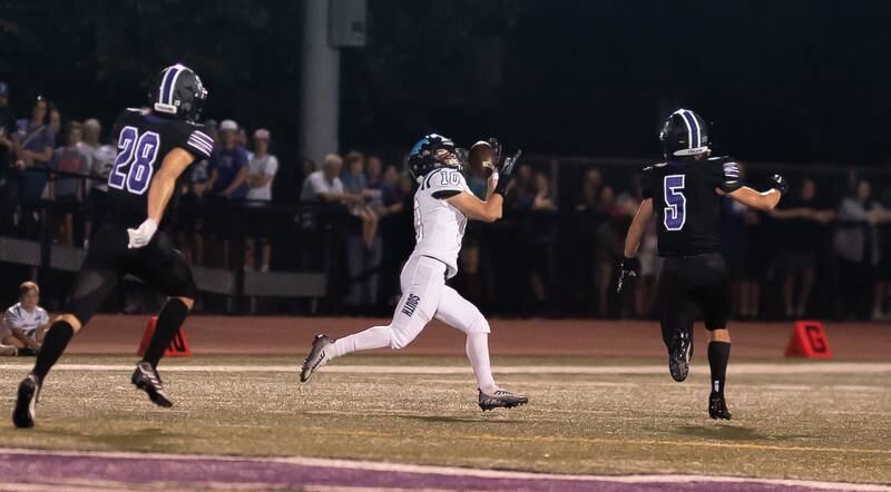 Downers Grove South's Ryan Horn-Salerno (10) catches a pass against Downers Grove North during a football game at Downers Grove North High School on Friday, Sep 9, 2022.