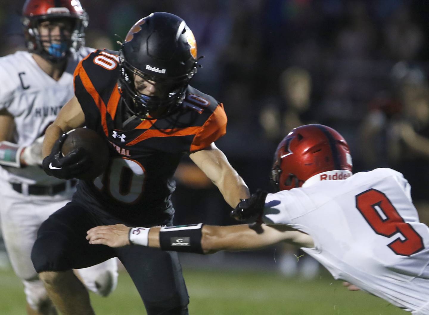 Crystal Lake Central's Griffin Buehler tries to avoid the tackle of Huntley's Liam Manning during a Fox Valley Conference football game Friday, Aug. 26, 2022, between Crystal Lake Central and Huntley at Crystal Lake Central High School.