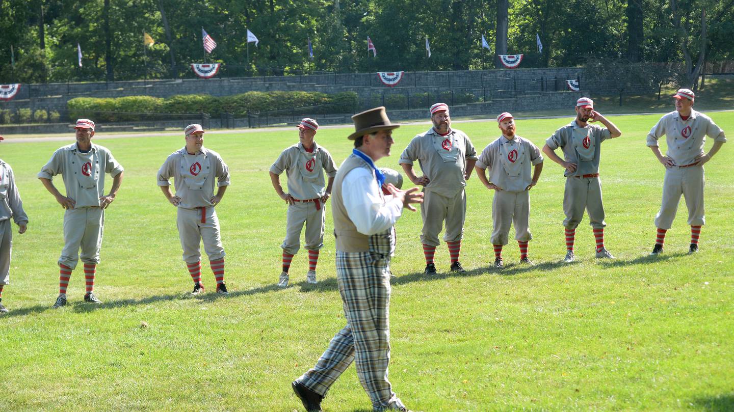 The Oregon Ganymedes listen to the umpire after their last game at the World Tournament of Historic Base Ball held at the Henry Ford Museum's Greenfield Village Sunday, Aug. 10, 2025 in Dearborn, Michigan.