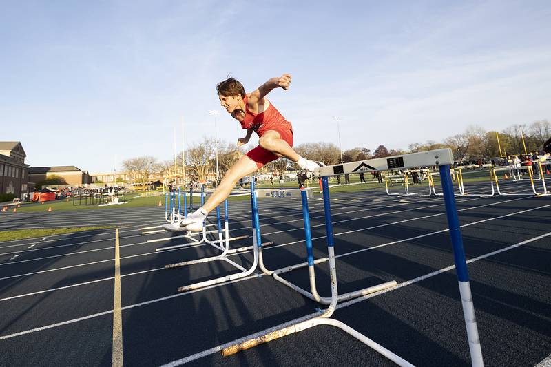 Ottawa’s Joey Liebhart clears the last hurdle in the low-hurdle shuttle Thursday, April 25, 2024 at the Sterling High School Night Relays.