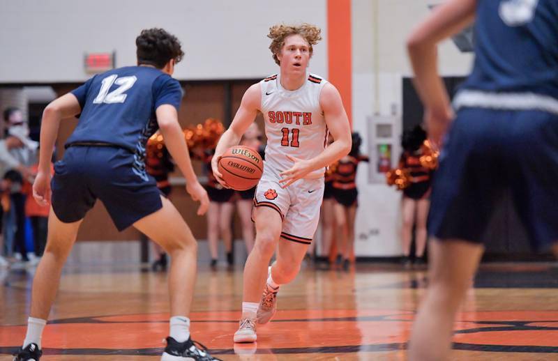 Wheaton Warrenville South's Colin Moore (11) looks for an opening against Lake Park during a game on Saturday, Jan. 7, 2023.