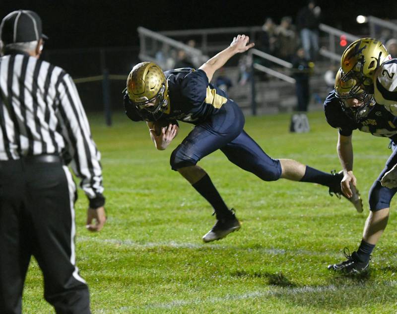 Polo's Brock Soltow scores a touchdown during 8-man playoff action against Hiawatha on Friday, Oct. 28.