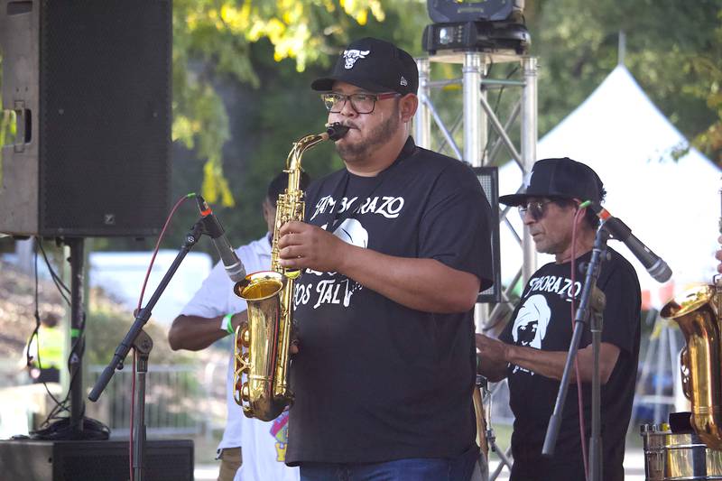 A member of Tamborazo Los Tali plays saxophone at Fiesta en el Bicentennial Park at Saturday, Sept. 14, 2024 at Billie Limacher Bicentennial Park in Joliet.
