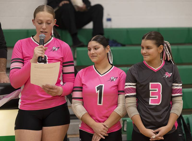 Rock Falls' volleyball captains  Kayla Hackbarth (left), Bre Dallgas-Frey and Isela Valdivia celebrate those fighting cancer Tuesday, Oct. 14, 2025, during their annual Pink Out game. Funds raised during the night will be donated to the Hope of Hope.