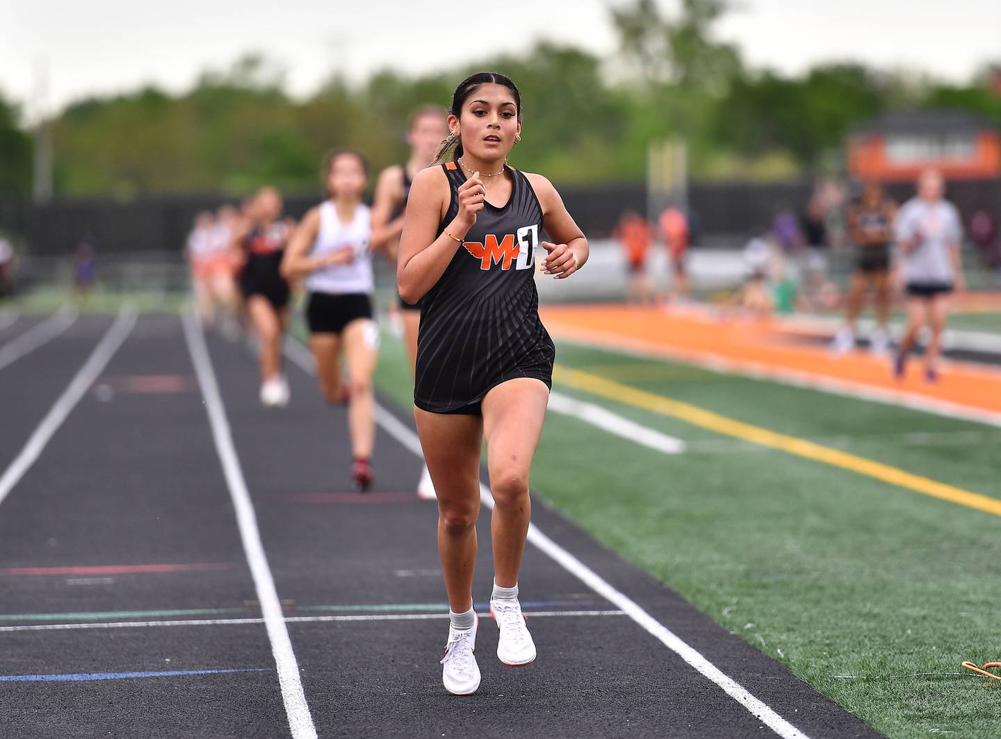 Minooka's Maya Ledesma competing in 3200 meter relay during the IHSA 3A Sectional track meet on Wednesday, May 08, 2024, at Minooka.