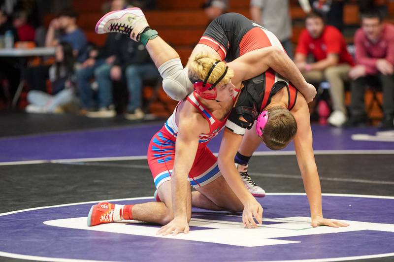 Oregon’s Anthony Bauer (left) competes in a 165 pound championship match against Gibson City-Melvin Sibley’s Cooper Miller during the Reaper Classic Wrestling meet at Plano High School on Saturday, Dec 9, 2023.