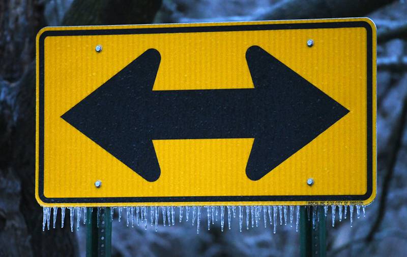 Icicles hang from a sign in Oregon late Wednesday afternoon as freezing rain fell across portions of Ogle County making travel hazardous for motorists and prompting cancellations of evening events.