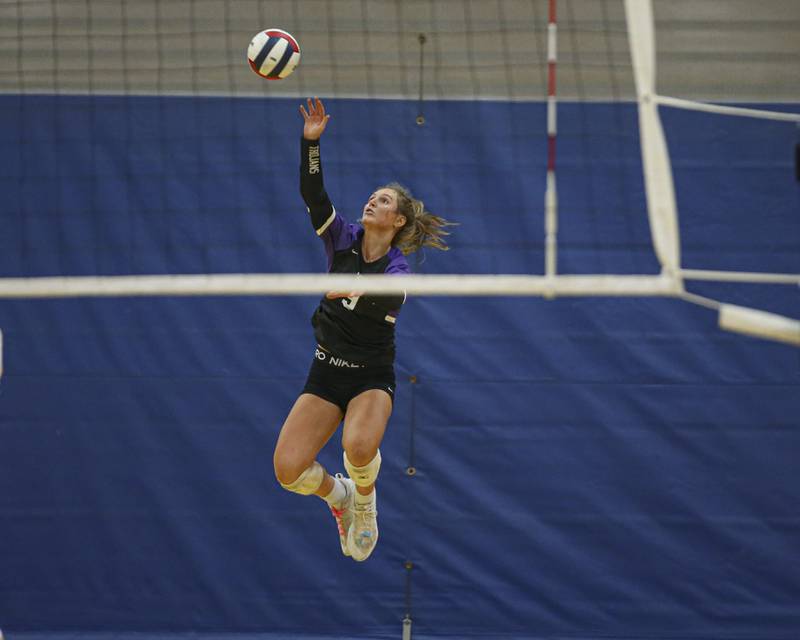 Downers Grove North's Kelley Crowley (9) serves during Class 4A Lyons Sectional Semifinal volleyball match between Downers Grove South at Downers Grove North. Nov 4, 2025 in La Grange.
