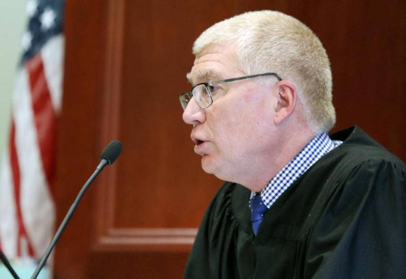 DeKalb County Judge Phillip Montgomery reads the list of charges for Jonathan Hurst, among them first-degree murder charges for the 2016 murders of Sycamore residents Robert Wilson and Patricia Wilson, during Hurst's arraignment Friday at the DeKalb County Courthouse.