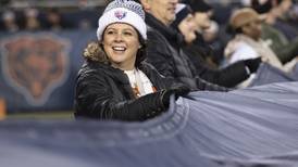 Round Lake cancer survivor unfurls Bear Down flag at game
