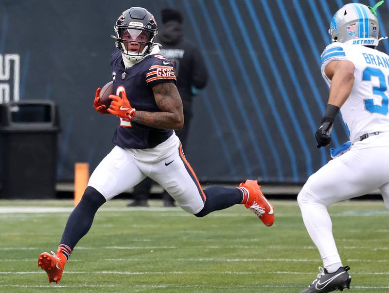 Chicago Bears wide receiver DJ Moore gets outside of Detroit Lions safety Brian Branch after a catch during their game Sunday, Dec. 22, 2024, at Soldier Field in Chicago.
