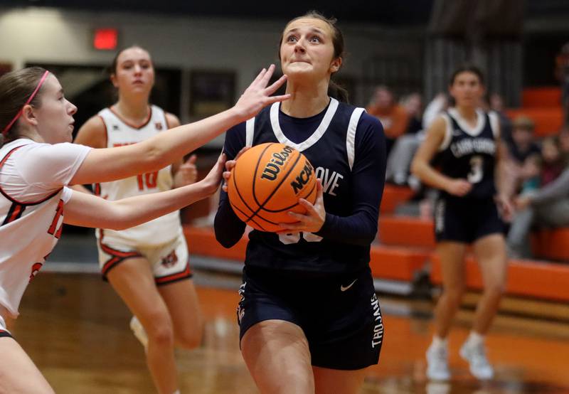 Cary-Grove’s Samantha Skerl gets past Crystal Lake Central’s Katelyn Hallum in varsity girls basketball on Tuesday, Jan. 7, 2025, at Crystal Lake Central High School in Crystal Lake.
