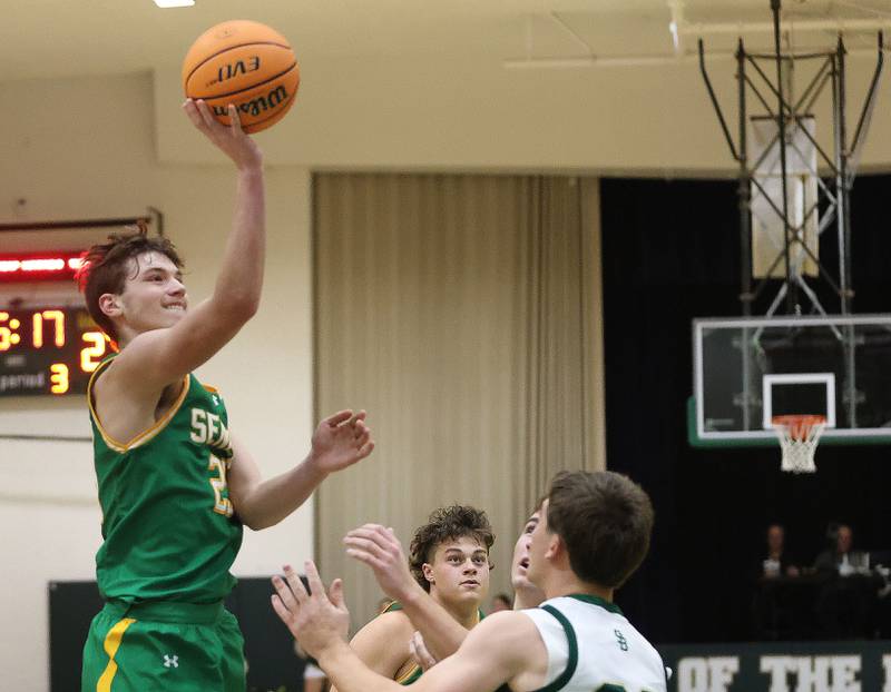 Seneca's Brady Sheedy lets go of a shot over St. Bede's AJ Hermes on Tuesday, Dec. 16, 2025 at St. Bede Academy.