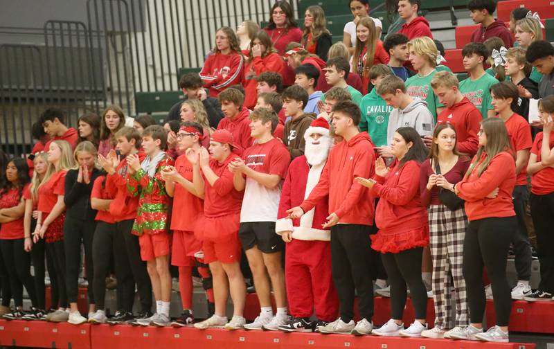 The L-P student section dresses in Christmas attire as they root for the Cavaliers as they play Pontiac on Tuesday, Dec. 17, 2024 in Sellett Gymnasium at L-P High School.