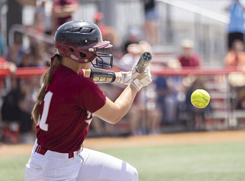 Antioch’s Samantha Hillner puts down a bunt that leads to the first run fo the game against Charleston Friday, June 9, 2023 in the class 3A state softball semifinal.