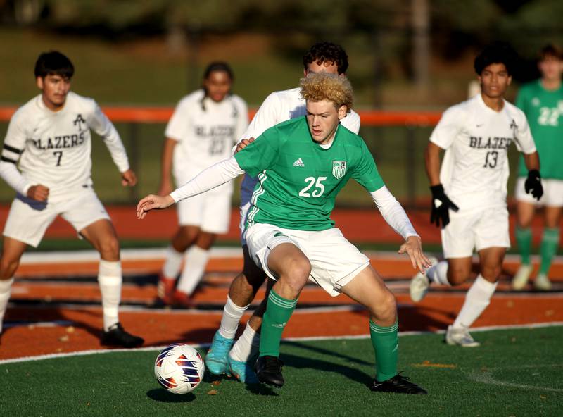 York’s Kevin O’Connor (25) goes after the ball in the first half of a Class 3A St. Charles East Sectional semifinal game against Addison Trail on Wednesday, Oct. 26, 2022.