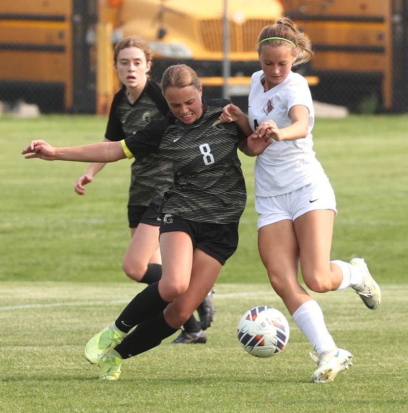 Sycamore's Anna Lochbaum (left) and Prairie Ridge's Emily Gorton collide going after the ball during their game Wednesday, May 17, 2023, at Sycamore High School.